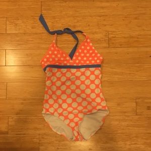 One piece swim suit + swim shorts